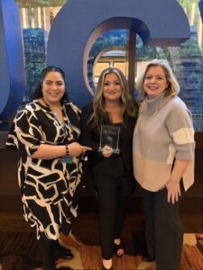 Anna Stanke with her award surrounded by Union Leasing employees
